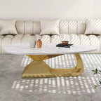 Table basse avec plateau en céramique et base contemporaine en acier inoxydable, une pièce maîtresse durable et élégante pour le salon.