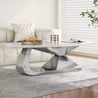 Table basse avec plateau en céramique et base contemporaine en acier inoxydable, une pièce maîtresse durable et élégante pour le salon.
