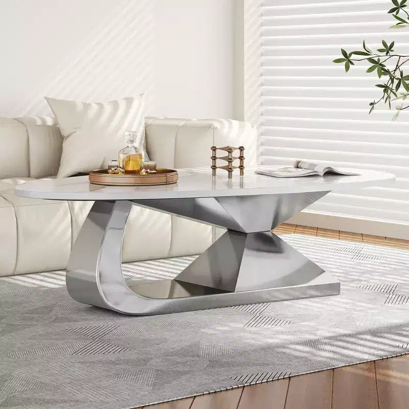 Table basse avec plateau en céramique et base contemporaine en acier inoxydable, une pièce maîtresse durable et élégante pour le salon.