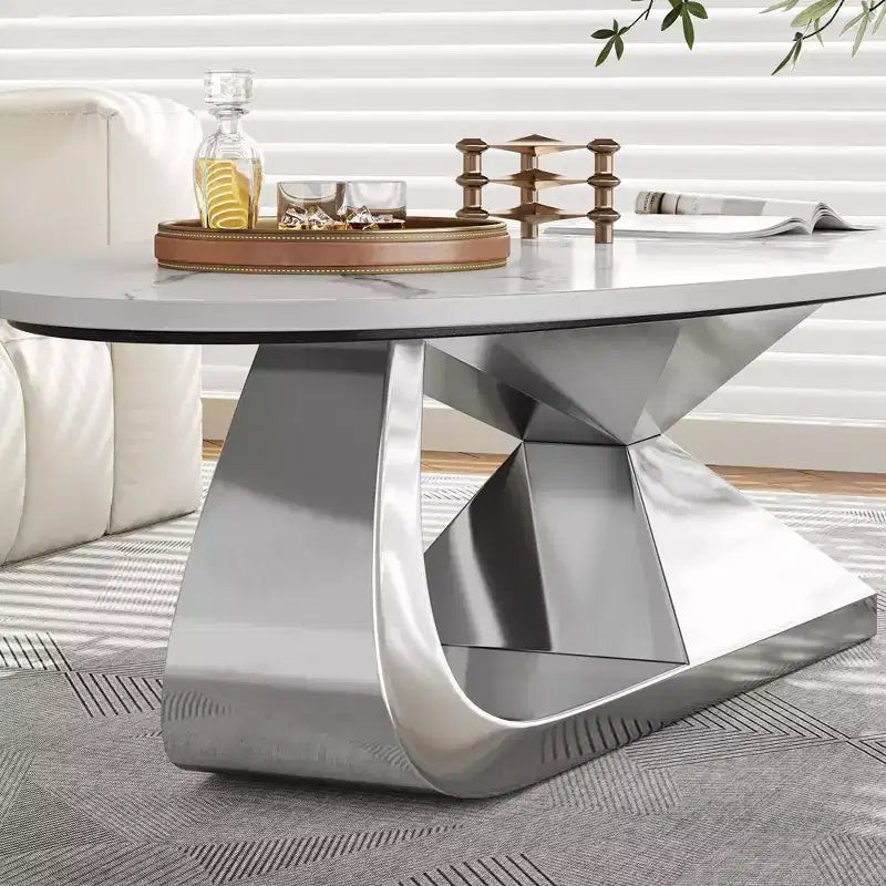 Table basse avec plateau en céramique et base contemporaine en acier inoxydable, une pièce maîtresse durable et élégante pour le salon.