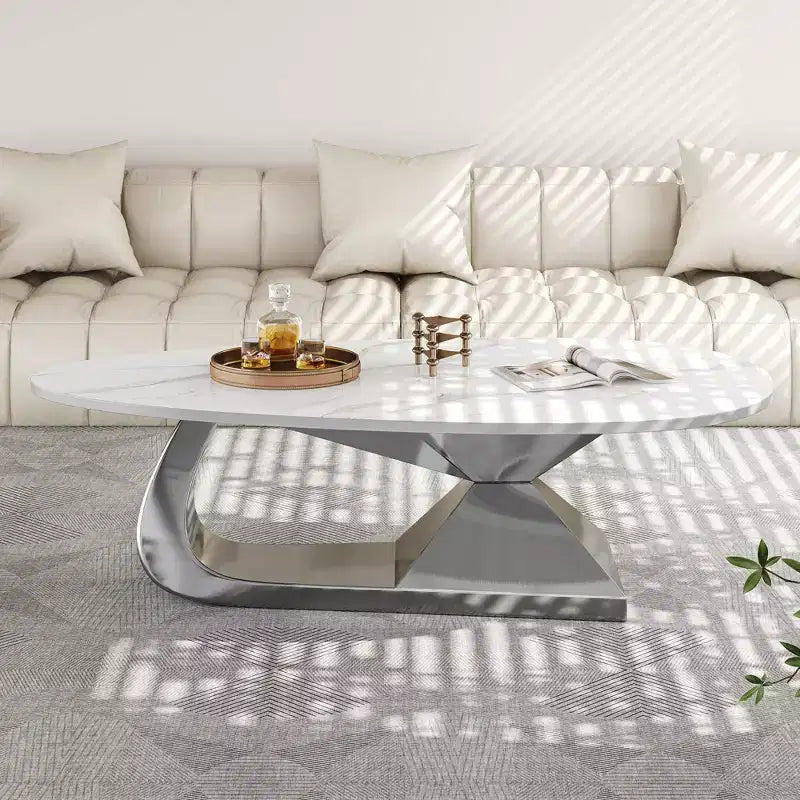 Table basse avec plateau en céramique et base contemporaine en acier inoxydable, une pièce maîtresse durable et élégante pour le salon.