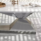 Table basse avec plateau en céramique et base contemporaine en acier inoxydable, une pièce maîtresse durable et élégante pour le salon.