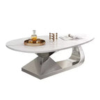 Table basse avec plateau en céramique et base contemporaine en acier inoxydable, une pièce maîtresse durable et élégante pour le salon.